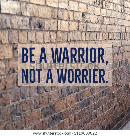 Inspirational motivational quote "Be a warrior, not a worrier." on beautiful brick wall background. 