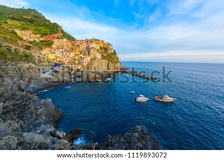 Manarola - Village of Cinque Terre National Park at Coast of Italy. Beautiful colors at sunset. Province of La Spezia, Liguria, in the north of Italy - Travel destination and attractions in Europe