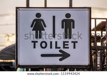 Ladies and Gentlemen Toilet signs. / Toilet sign and symbol with arrow on white background. / Badges for men and women. /The icons on signage that identify public toilets.