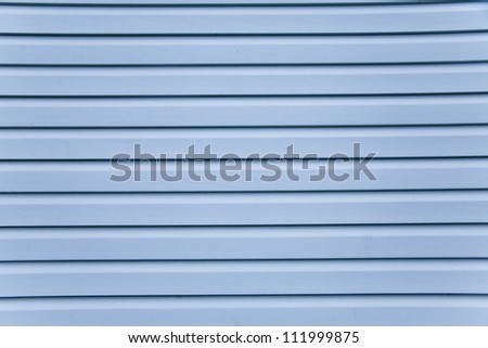 Wooden wall. Slice the blue siding Royalty-Free Stock Photo #111999875