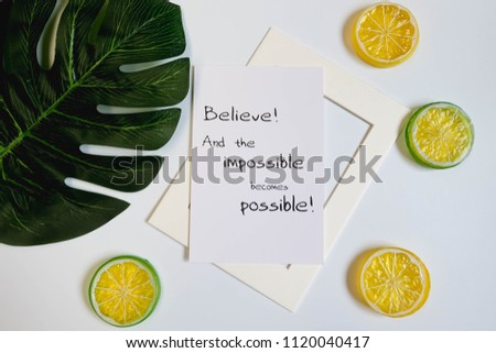 Picture frame with lemon and green palm leaves on white background, minimal style with spring concept