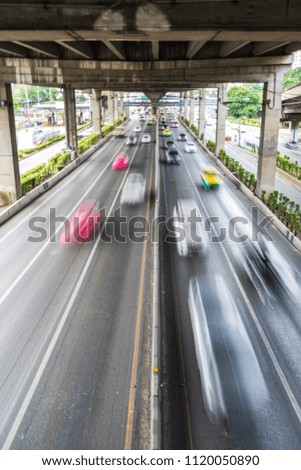 Motion blur of car on the road in the city