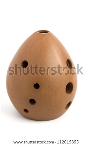 Ancient Asian musical instrument "Xun" made of clay and similar to ocarina, isolated on white background Royalty-Free Stock Photo #112015355