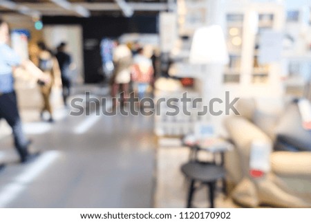Blur people shopping in home mart superstore with modern furniture