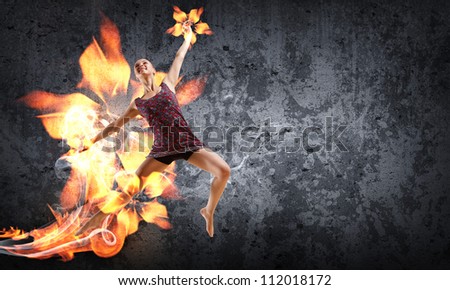 Girl dancing in a color dress with a gray background. Collage with place for text