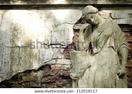 Monument of ancient angel on cemetery