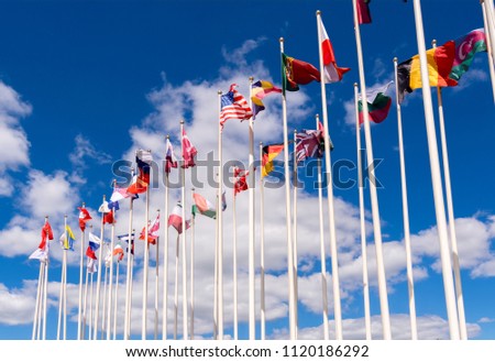 National flags on the masts. The flags of the United States, Germany, Belgium, Italia,Israel, Turkey and other Royalty-Free Stock Photo #1120186292