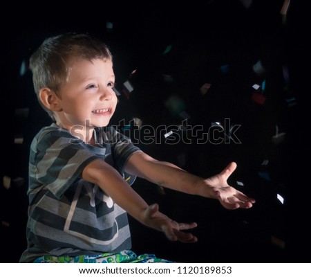 Little boy having fun celebrating birthday. Positive emotions .