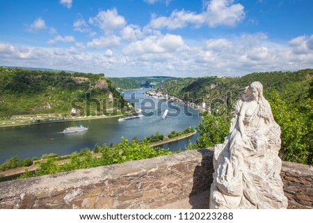 Loreley figure and  Rhine valley Landscape and Sankt Goarshausen view from the Lore Ley rock Germany Intersting Places Royalty-Free Stock Photo #1120223288