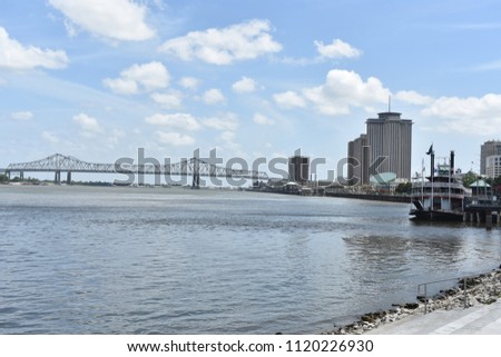 A paddleboat is docked on the Mississippi River near downtown New Orleans.