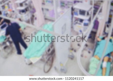Blur image of patients and doctor team with treatment in emergency room at the hospital.