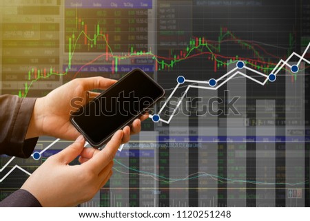 Double exposure businessman use smartphone on stock market graph for business concept about financial investment.space for use and design.