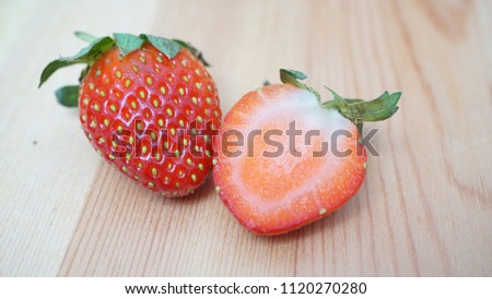  Fresh ripe strawberry on wooden background. Selective focus                              