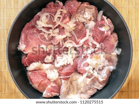 Raw beef in marinade prepared for roasting