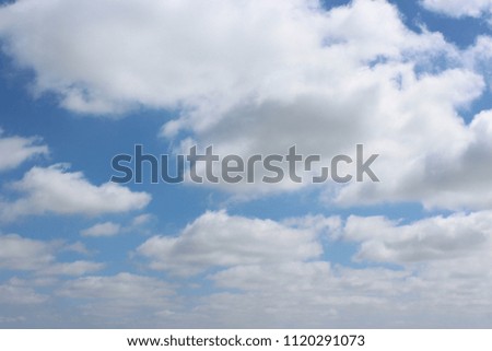 A beautiful blue sky with awesome bright white clouds.