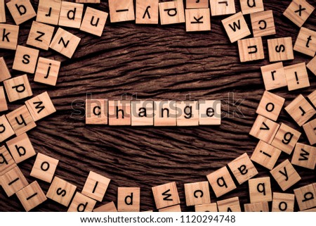 Change word written cube on wooden background. Vintage concept.