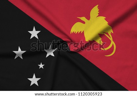 Papua New Guinea flag  is depicted on a sports cloth fabric with many folds. Sport team banner