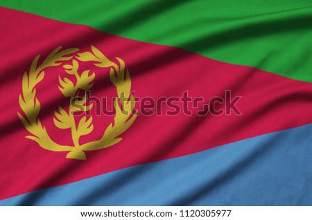Eritrea flag  is depicted on a sports cloth fabric with many folds. Sport team banner