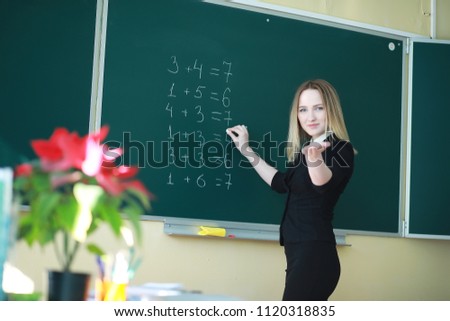 Young girl teacher in primary school