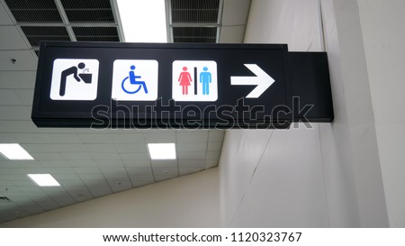 public restroom or toilet signs over head