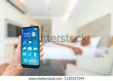 Smart phone with smart home app in bedroom