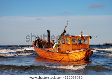 Fishing Boat at Baltic Sea Coast of Usedom Island, Germany Royalty-Free Stock Photo #112035080