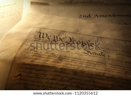 Article One of the US Constitution with 2nd and 5th Amendments in the background                                Royalty-Free Stock Photo #1120355612