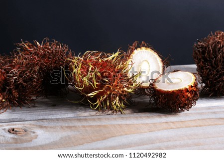 Rambutans fruit with leaf on table. Rambutan or hairy lychee.
