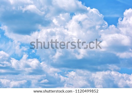 Aerial white clouds against the blue sky. A beautiful natural phenomenon.