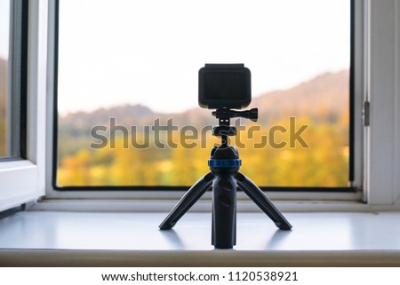 Camera timelapse on the white window sill