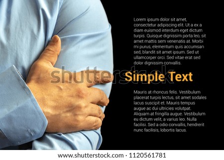 Crossed arms of a man dressed in a light blue shirt. On a black background, you can insert any of your text