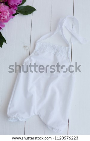 white baby bodysuit. clothes for the baby. children's clothes. white suit on newborn
