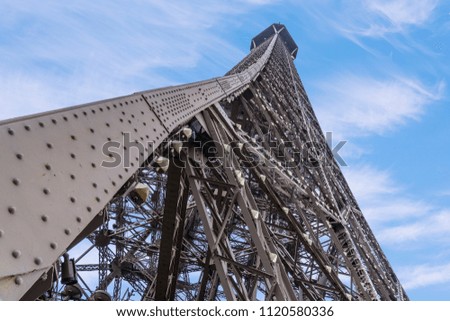 Iconic Landmark Steel Structure of Eiffel Tower in Paris France and Blue Sky and Clouds