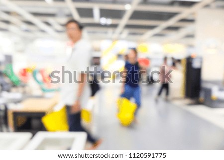 Blur people shopping in home mart superstore with modern furniture