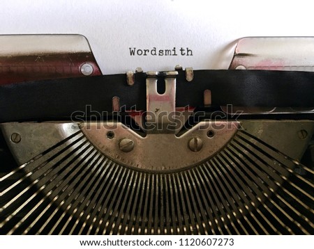 Wordsmith, writer occupation terminology, typewritten in black ink on vintage manual typewriter machine