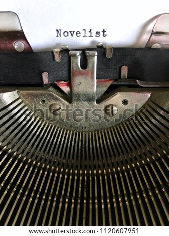 Novelist, writer occupation terminology, typed in black ink on vintage manual typewriter machine