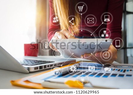 
businesswoman or Designer using smart phone with laptop and digital tablet computer and document on desk in modern office with virtual interface graphic icons network diagram
