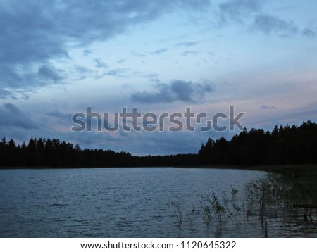 View at Panorama of Lake with Dark Storm Clouds on the Sky