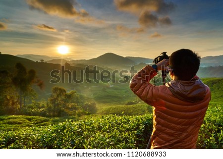                                Photographer Shooting Sunset