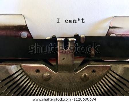 I Can't, short phrase typewritten in black ink on vintage manual typewriter machine