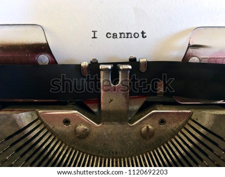 I Cannot, short phrase typewritten on vintage manual typewriter machine