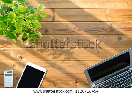 Laptop and wood table