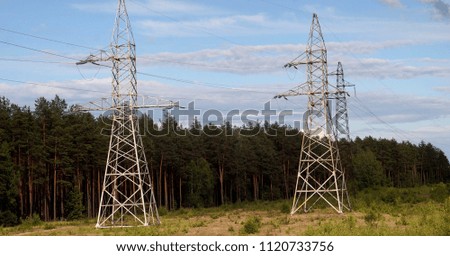   towers of high voltage wires                             