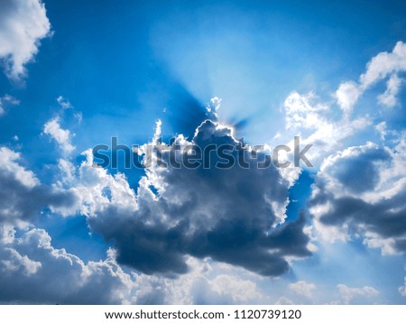 Sunbeam through the haze on blue sky: can be used as background and dramatic look