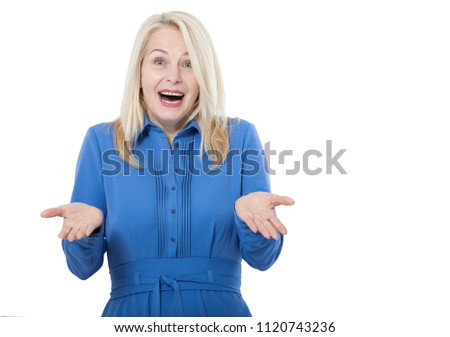 Portrait of happy middle aged woman. Surprised happy woman looking with her mouth open and holding her arms out in excitement. Isolated on white background