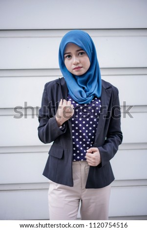 Portraiture of a beautiful young asian muslim businesswoman. People business working concept.