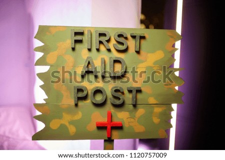 a sign with the word "first aid point".