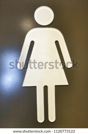 Symbol of woman in restroom.