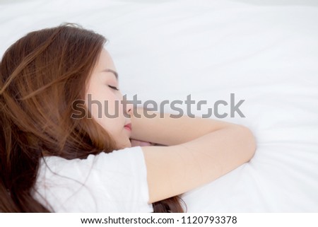 Portrait of beautiful asian young woman sleep lying in bed with head on pillow comfortable and happy with leisure, girl with relax  for health and lifestyle concept, top view.