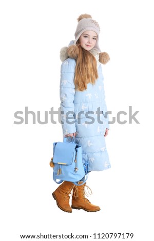Happy little girl posing with backpack 